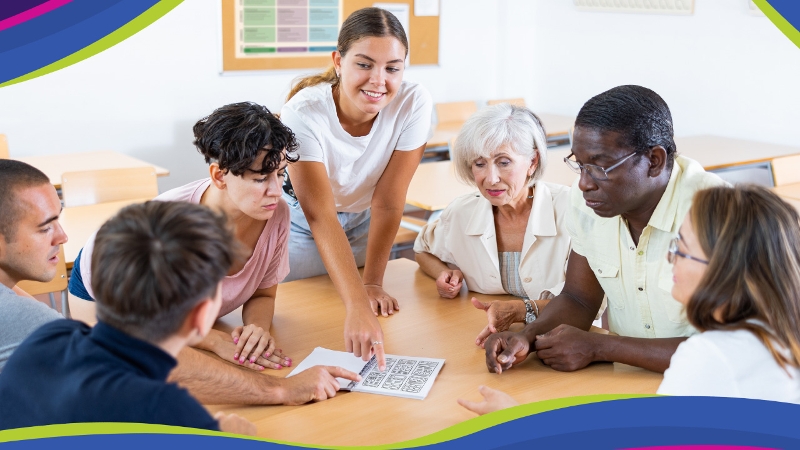 A group of adults collaborating together in person